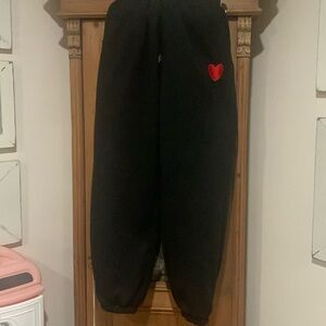 Black sweat pants with red heart. Super cute and comfy!